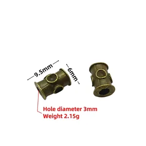 Detailed size view of antique bronze barrel beads with measurements 9.5mm by 6mm