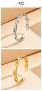 Detail view of woven textured open rings in gold and silver finish with adjustable bands