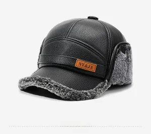 Detail of winter thermal hat showing black lychee leather and gray faux fur lining