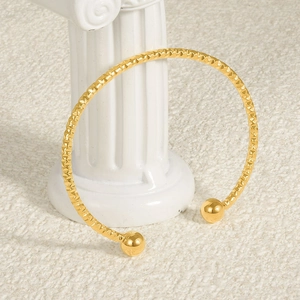 18k gold plated stainless steel open bangle with textured diamond pattern and polished beads