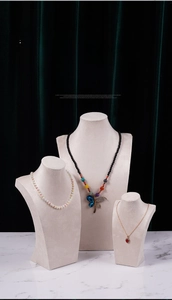 Velvet necklace bust display featuring pearl strand and crystal dragonfly pendant chains