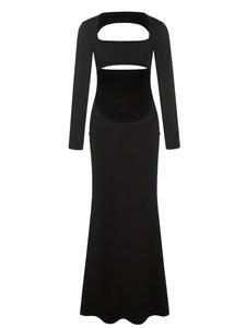 Detail of a black open-back maternity dress with long sleeves and fishtail design