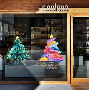 Festive Christmas tree window decals applied on glass with Merry Christmas lettering