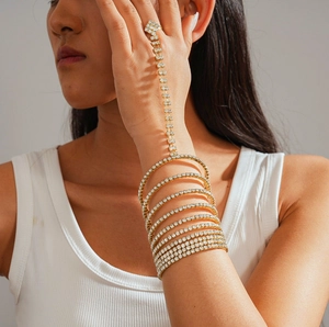 Close-up of gold geometric slave bracelet with crystal layers on model's hand