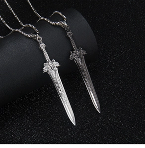 Macro view of vintage silver lion sword pendants displayed on black cylindrical stands