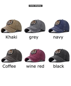 Color display of vintage washed cotton baseball caps with tiger head embroidery