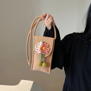 Handmade woven phone bag with 3D crochet flowers and strap for beach vacations
