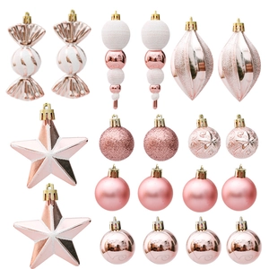 18-piece rose gold Christmas ornament set with candy, star, and ball shapes on white background