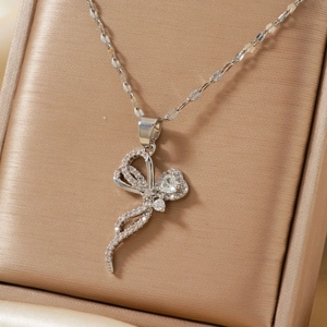 Silver butterfly necklace with micro-paved zircons in a champagne silk jewelry box
