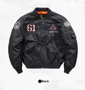 Detail of black MA-1 bomber jacket featuring tactical embroidery and orange lining