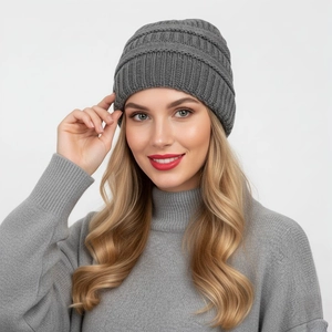 Detail of dark grey knit beanie showing ribbed texture and soft wool blend material