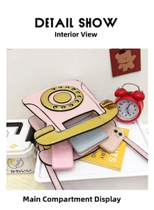 Interior view of pink retro telephone crossbody bag showing space for phone and wallet