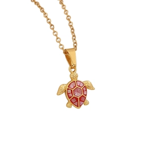 Gold stainless steel necklace with red natural shell turtle pendant on white background