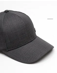Detail of dark grey baseball cap with fine twill texture and wide curved brim
