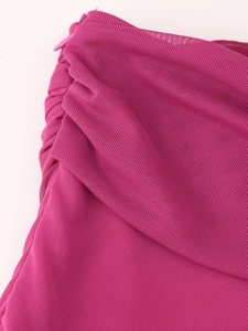 Detail of rose red mesh fabric with pleated texture and side ruched stitching