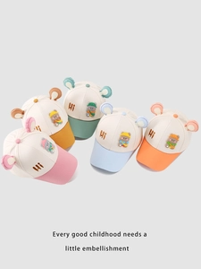 Close-up detail showing the 'Hi' embroidery and cute animal ears on these baby caps.