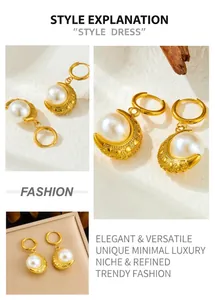 Macro view of gold crescent moon earrings featuring white pearls and bead textures