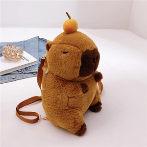 Cute Capybara plush backpack in brown with adjustable straps on white bed linen
