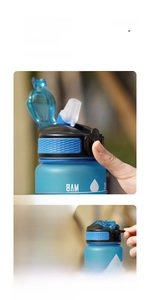 Detail of 32oz sports bottle featuring safe lock mechanism and one-click open lid