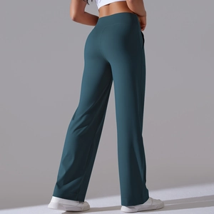 Rear view of high waist wide leg yoga pants in deep cyan with stretch fabric detail