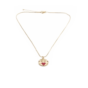 Detail of gold-plated necklace with red heart pendant and cross design features