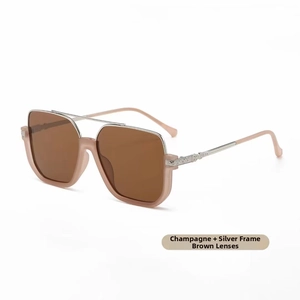 Detail of champagne frame sunglasses with silver metal bridge and tea-colored lenses