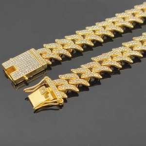Detailed close-up of 16mm gold thorns Cuban chain with shimmering crystal rhinestones