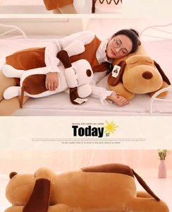 Detailed view of soft plush puppy pillows in brown and white on a cozy bedroom bed
