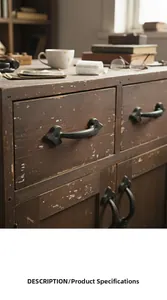 Close-up of vintage black cast iron arrow handle mounted on rustic wooden door