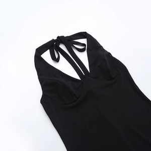 Detail of black halter neck dress with deep V-neckline and tie-back neck straps