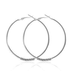 Oversized silver hoop earrings with shimmering crystal embellishments and metal luster