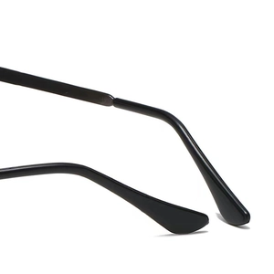 Close-up of curved black temples of polarized sunglasses showing material texture and finish