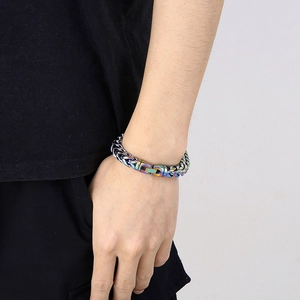 Detailed macro view of iridescent rainbow titanium steel bone chain with rotating clasp