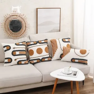 Close-up of bohemian geometric tufted embroidery on cotton-linen pillow covers set