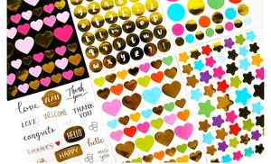 Detail of colorful gold-stamped star and heart stickers for DIY scrapbooking