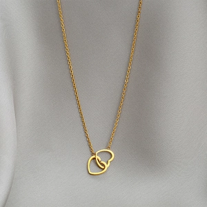 Elegant gold double heart necklace for women featuring a minimalist interlocking design
