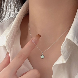 Minimalist S925 sterling silver necklace with a round opal stone pendant worn by model