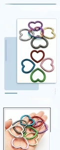 Macro detail of heart-shaped alloy buckles in multiple colors for DIY jewelry and crafts
