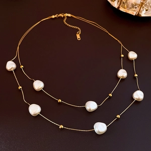 Double-layered gold stainless steel necklace with baroque pearls and adjustable chain link