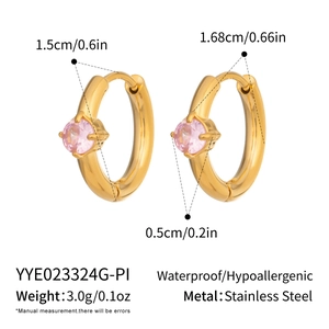 Macro detail of 18K gold plated stainless steel hoops with pink cubic zirconia stones
