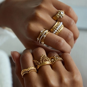 Bohemian gold-plated stackable ring set with zircon crown and pearl details