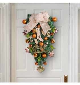 Detail of Christmas teardrop swag with gold balls and Merry Christmas greeting