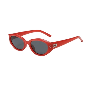 Trendy red cat eye sunglasses with dark lenses and silver stud details for women