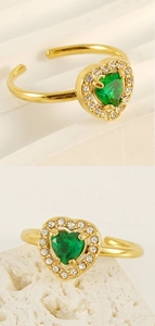 Detailed macro view of an 18K gold-plated double-layer ring with green heart-shaped zircon