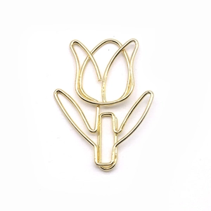 Golden tulip-shaped metal paperclip bookmark with minimalist floral design on white background