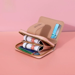 Pink and beige bifold women's wallet showing internal multi-slot card holder and zipper pocket