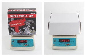 Comparaison du poids de l'emballage du pistolet à billets: boîte couleur 387g et blanc 420g