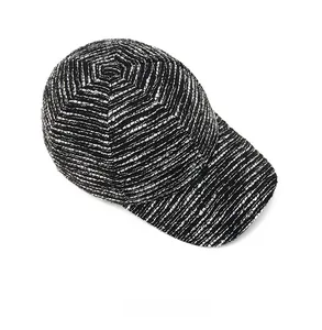 Top view of tweed baseball cap showing premium woven fabric texture and stitching details
