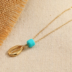 Retro vintage beach style golden necklace with blue bead and seashell pendant