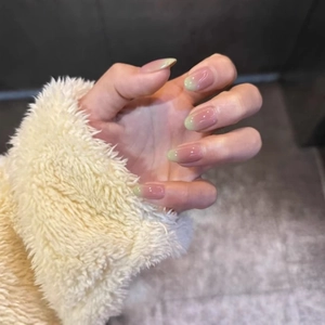 Pink and green gradient almond press-on nails with soft winter aesthetics